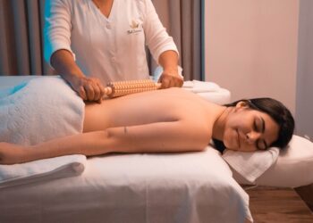 woman-receiving-ayurvedic-massage-unsplash - INDIAwebzine A therapist performs a traditional Shirodhara treatment on a guest at one of the heritage Kerala retreats during Onam season