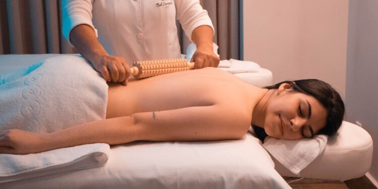 woman-receiving-ayurvedic-massage-unsplash - INDIAwebzine A therapist performs a traditional Shirodhara treatment on a guest at one of the heritage Kerala retreats during Onam season