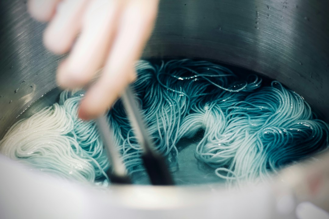 Women artisans in a collective preparing natural dye batches to expand handloom inventory for Navratri and Diwali demand.