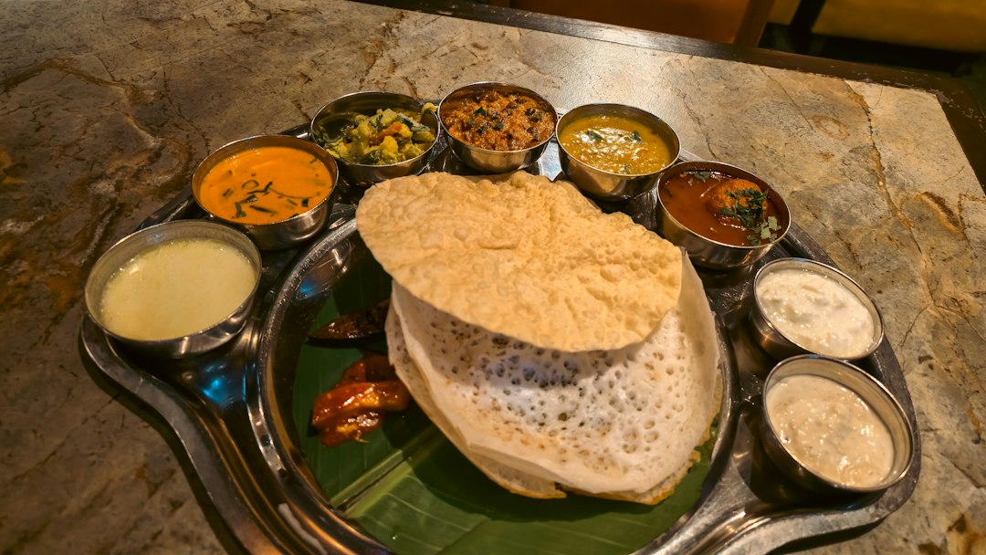 Family serving a traditional meal at a Kerala backwater homestays stay