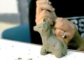 Artisan shaping Bengal terracotta horse in Panchmura workshop