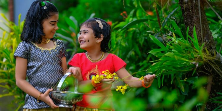 Host welcoming guests outside one of Kerala's backwater homestays